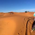 Riding a camel into the Moroccan desert