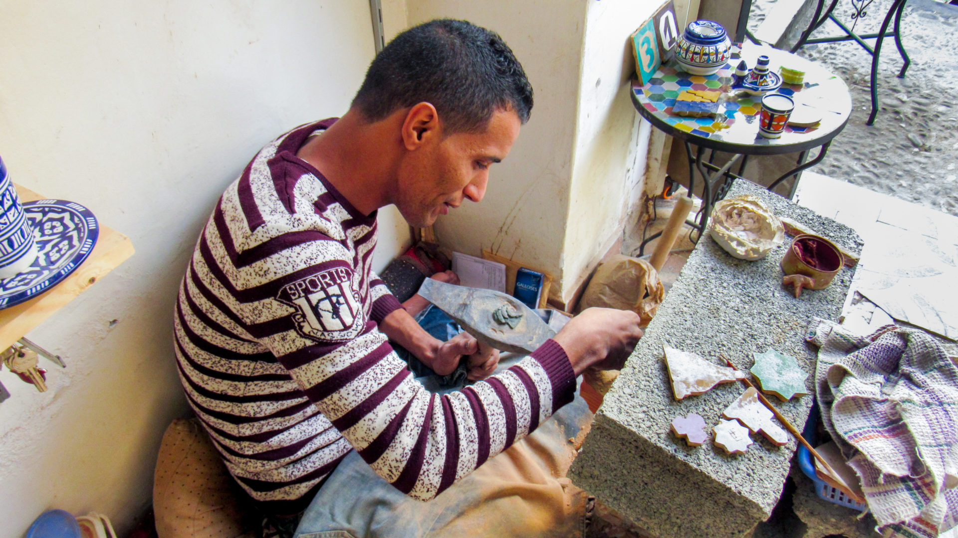 Driss making zellij tile.